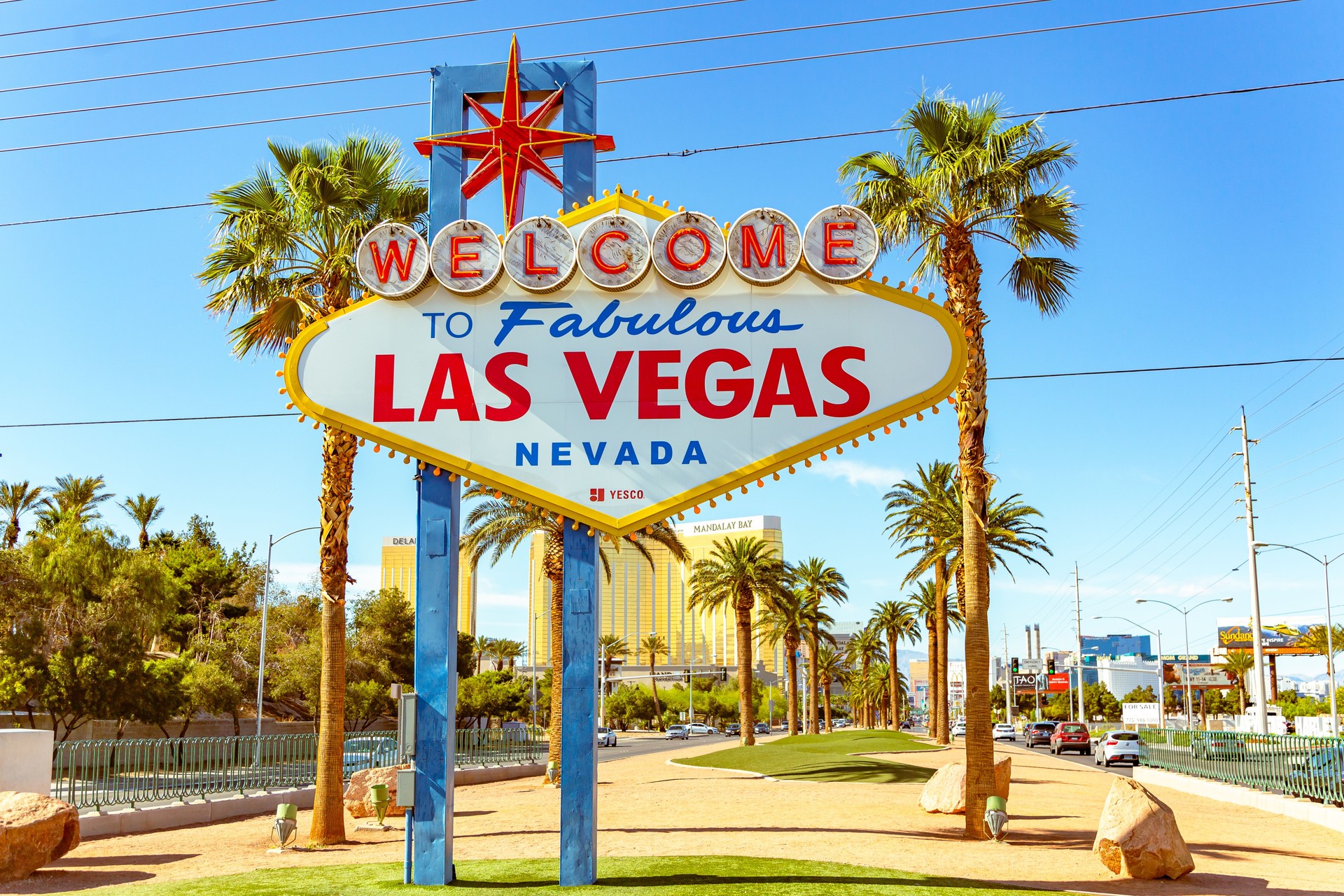 Sky, palm trees, and iconic welcome sign welcome you to fabulous Las Vegas